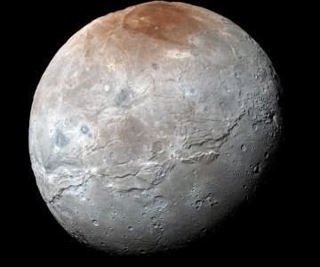 Pluto’s Big Moon Charon Reveals a Colorful...